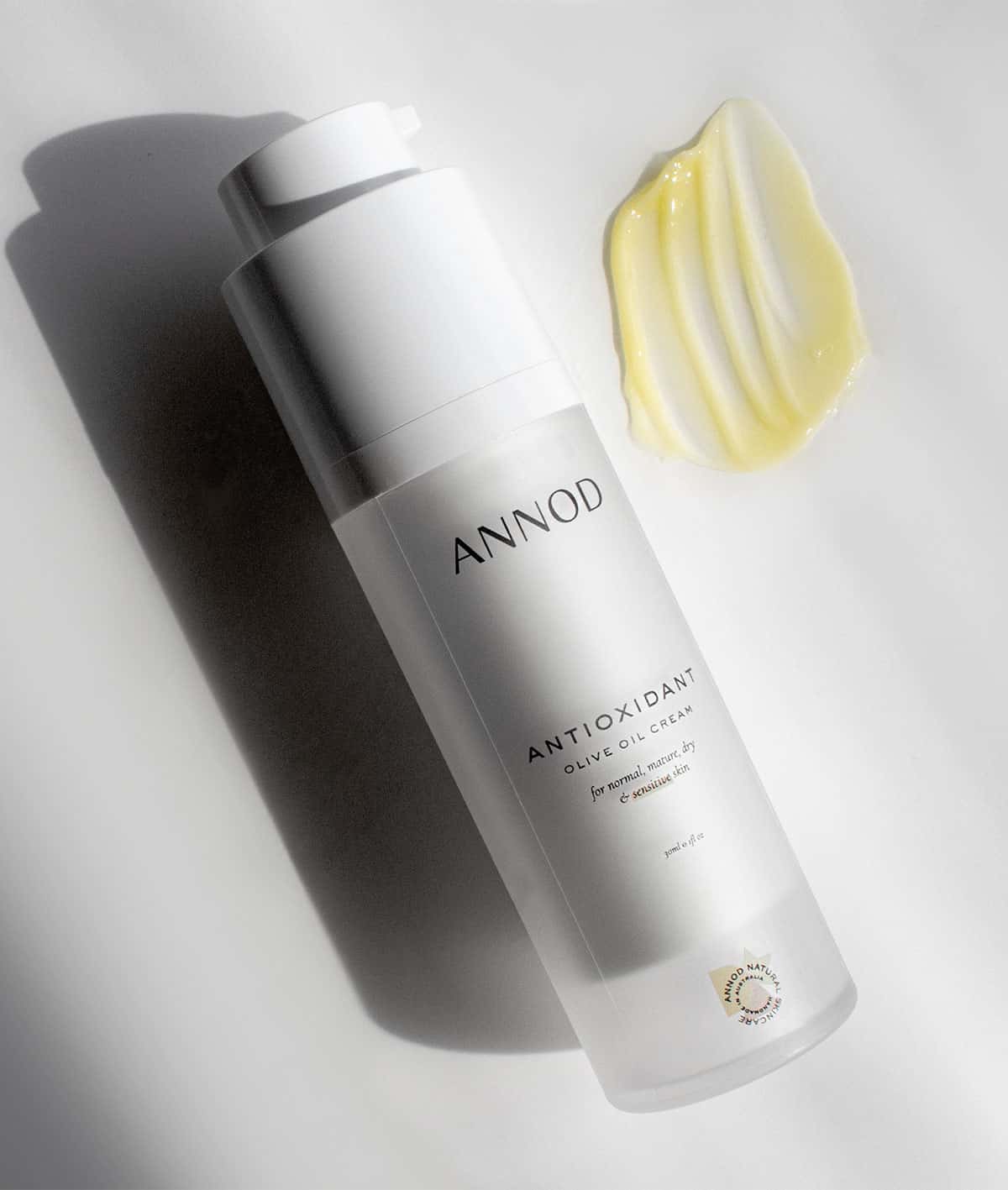 Texture and a bottle of Antioxidant Olive Oil cream, 30ml