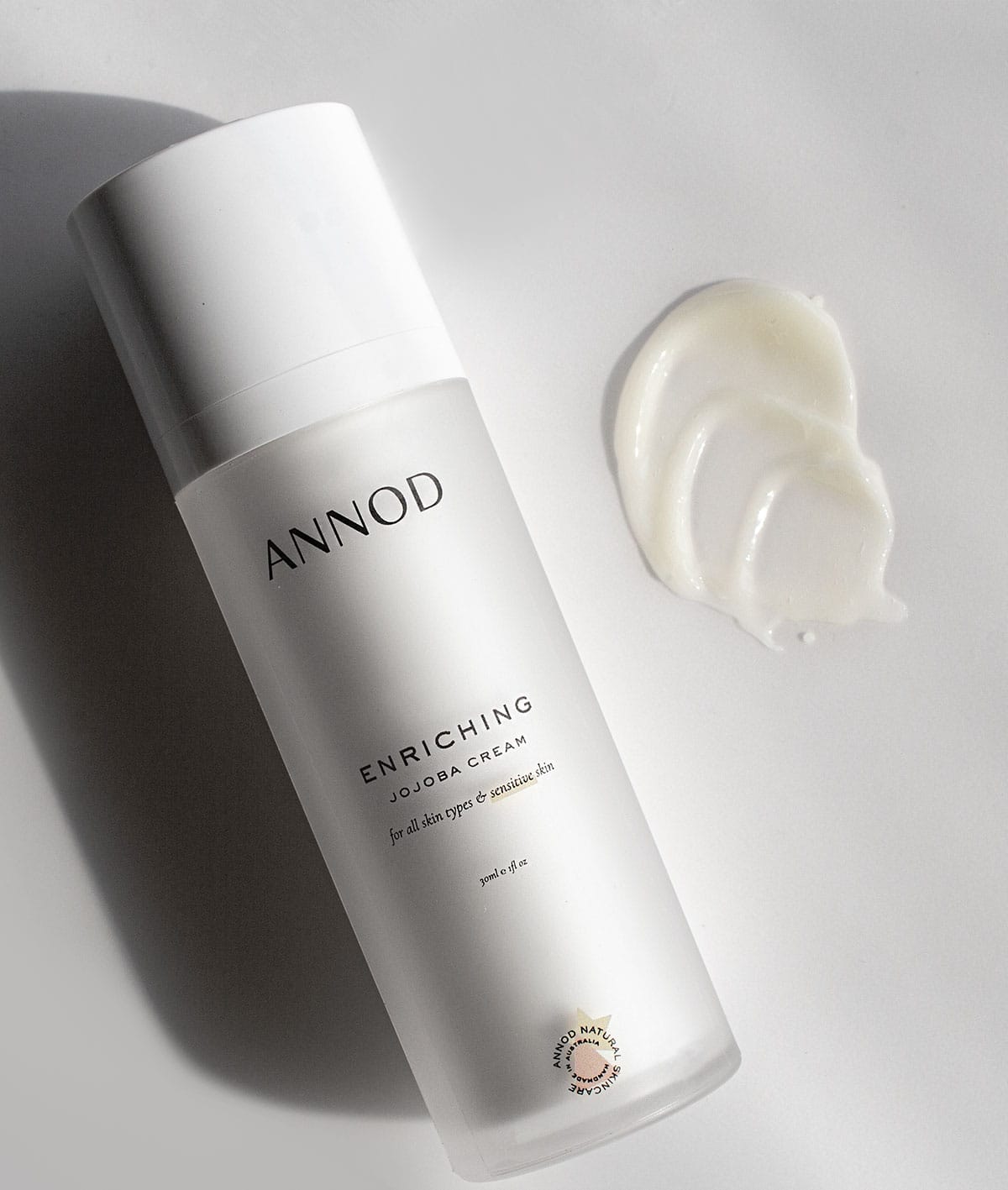 Texture and a bottle of Enriching Jojoba Cream, 30ml